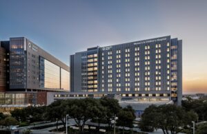 University Health Women’s & Children’s Hospital at dusk, highlighting modern healthcare construction designed for women’s and children’s healthcare in South Texas.