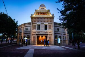 The beautifully restored Pearl Stable Hall in San Antonio, a historic renovation project showcasing 19th-century architecture with intricate brickwork and arched windows.